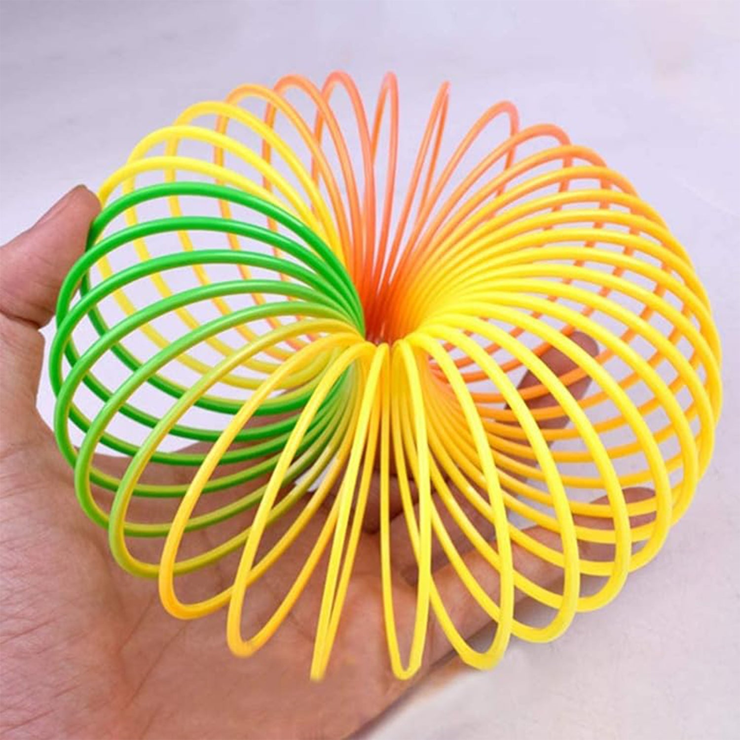 Rainbow Slinky Spring Toy – Compact, Portable Fun Toy for Kids & Adults, Great for Birthdays (1 Pc) Rainbow Slinky Spring Toy – Compact, Portable Fun Toy for Kids & Adults, Great for Birthdays (1 Pc)